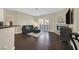 Cozy living room with dark wood floors, a modern fireplace, and a comfortable leather sofa at 2050 W Warm Springs Rd # 823, Henderson, NV 89014