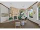 Spacious community lobby with stone fireplace, comfortable seating, and large windows overlooking greenery at 2050 W Warm Springs Rd # 823, Henderson, NV 89014