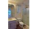 Well-lit bathroom with vanity, toilet, and glass-enclosed shower at 2138 Grand Traverse St, Henderson, NV 89052