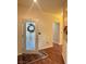 Inviting entryway with decorative glass door, rug, and hardwood floors at 2138 Grand Traverse St, Henderson, NV 89052