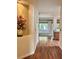 Inviting hallway with hardwood flooring and an alcove displaying floral arrangements at 2138 Grand Traverse St, Henderson, NV 89052
