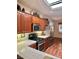 Well-equipped kitchen featuring tile countertops, stainless steel appliances, and wood cabinetry at 2138 Grand Traverse St, Henderson, NV 89052