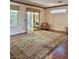 Spacious living room with hardwood floors, a large rug, and sliding glass doors to the patio at 2138 Grand Traverse St, Henderson, NV 89052