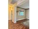 Open living space with hardwood floors and a view into another room through an opening at 2138 Grand Traverse St, Henderson, NV 89052