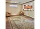 Open living room with hardwood floors, seating area, and a view to the kitchen at 2138 Grand Traverse St, Henderson, NV 89052