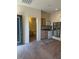 Open-concept living space with kitchenette and bathroom access at 2138 Grand Traverse St, Henderson, NV 89052