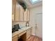 Office space with custom cabinets, desk, and a door leading outside at 2138 Grand Traverse St, Henderson, NV 89052