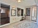 Sunroom showcasing tile floors, built-in bookshelves, and access to the backyard at 2138 Grand Traverse St, Henderson, NV 89052