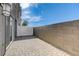 Back patio with pavers, modern exterior, and privacy fence at 226 White Crest Peak Ave, Henderson, NV 89015