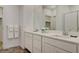 Bright bathroom featuring double sinks and a walk-in shower at 226 White Crest Peak Ave, Henderson, NV 89015