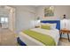 Comfortable bedroom with closet, modern lighting, and access to living areas at 226 White Crest Peak Ave, Henderson, NV 89015