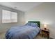 Comfortable bedroom with a large window, plush carpet, and tasteful decor at 226 White Crest Peak Ave, Henderson, NV 89015