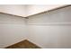 Empty walk-in closet with rod and shelf ready for storage at 226 White Crest Peak Ave, Henderson, NV 89015