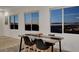 Modern kitchen with expansive windows provides natural light and panoramic city and mountain views at 226 White Crest Peak Ave, Henderson, NV 89015