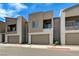 Modern townhouse with attached garage and balcony on a sunny day at 226 White Crest Peak Ave, Henderson, NV 89015