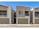 Modern townhouse with a neutral color scheme, attached garage, and balcony under a clear blue sky at 226 White Crest Peak Ave, Henderson, NV 89015