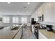 Modern kitchen with white cabinets, and stainless appliances at 226 White Crest Peak Ave, Henderson, NV 89015