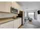 Cozy kitchen with stainless steel refrigerator next to the living area at 226 White Crest Peak Ave, Henderson, NV 89015