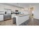 Bright, modern kitchen with stainless steel appliances and large center island at 226 White Crest Peak Ave, Henderson, NV 89015