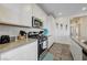 Well-equipped kitchen with stainless steel appliances and white cabinets at 226 White Crest Peak Ave, Henderson, NV 89015
