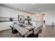 Modern kitchen with white cabinets, stainless steel appliances, and a large center island at 226 White Crest Peak Ave, Henderson, NV 89015