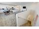 Upstairs view of an open-concept living space with a kitchen and staircase at 226 White Crest Peak Ave, Henderson, NV 89015