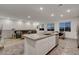 Contemporary living room with a sleek kitchen, a comfortable sofa, and city views at 226 White Crest Peak Ave, Henderson, NV 89015
