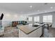 Spacious living room featuring a modern kitchen island and a view of the neighborhood at 226 White Crest Peak Ave, Henderson, NV 89015