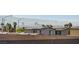 View of the city skyline and mountains from a house with solar panels at 226 White Crest Peak Ave, Henderson, NV 89015