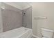 Bathroom with a tub-shower combination featuring white porcelain fixtures and a shower curtain rod at 2606 S Durango Dr # 245, Las Vegas, NV 89117