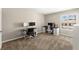 Bedroom featuring dual computer desks and a window, perfect for a home office or study space at 2606 S Durango Dr # 245, Las Vegas, NV 89117