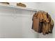 Functional closet interior with clothes rail and shelf for convenient storage solutions at 2606 S Durango Dr # 245, Las Vegas, NV 89117