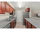 Well-lit kitchen featuring stainless steel appliances and dark wood cabinets at 2606 S Durango Dr # 245, Las Vegas, NV 89117