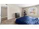 Bright main bedroom with a large window and an organized storage area at 2606 S Durango Dr # 245, Las Vegas, NV 89117