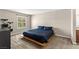 Spacious main bedroom with a platform bed and natural light from a large window at 2606 S Durango Dr # 245, Las Vegas, NV 89117