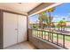 Cozy patio with view of the swimming pool and tropical palm trees in the distance at 2606 S Durango Dr # 245, Las Vegas, NV 89117