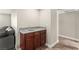 Cozy wet bar area with granite countertops and wooden cabinets at 2606 S Durango Dr # 245, Las Vegas, NV 89117