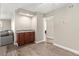 Cozy area featuring a wet bar with granite countertops and wooden cabinets at 2606 S Durango Dr # 245, Las Vegas, NV 89117