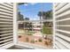 Bright window view overlooking the green space and community pool with white window shutters at 2606 S Durango Dr # 245, Las Vegas, NV 89117
