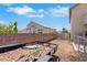 Large backyard with privacy fence and trailer, providing ample space for outdoor activities and storage at 2684 Korea Ct, Henderson, NV 89052