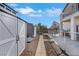 Backyard with storage shed, pathway, and chainlink fence, providing organized outdoor space at 2684 Korea Ct, Henderson, NV 89052