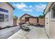 Backyard patio with outdoor furniture, firepit, and storage shed, an inviting space for relaxation at 2684 Korea Ct, Henderson, NV 89052