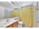 Bathroom featuring a shower with curtain, single sink vanity, and wood-look floors at 2684 Korea Ct, Henderson, NV 89052