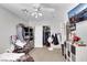 Bedroom with neutral carpet, ceiling fan, closet, and a window providing natural light at 2684 Korea Ct, Henderson, NV 89052