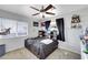 Bedroom with neutral carpet, ceiling fan, and a window providing natural light at 2684 Korea Ct, Henderson, NV 89052