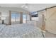 Bedroom featuring a barn door leading to the bathroom and a TV mounted on the wall at 2684 Korea Ct, Henderson, NV 89052