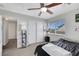 Bedroom with neutral carpet, ceiling fan, closet, and a window providing natural light at 2684 Korea Ct, Henderson, NV 89052