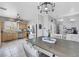 Well-lit kitchen and dining area with stainless steel appliances and a view of the backyard at 2684 Korea Ct, Henderson, NV 89052