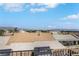 Tiled roof view showcasing the neighborhood and distant city skyline under a bright, sunny sky at 2684 Korea Ct, Henderson, NV 89052