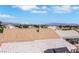 Tiled roof view showcasing the neighborhood and distant city skyline under a bright, sunny sky at 2684 Korea Ct, Henderson, NV 89052